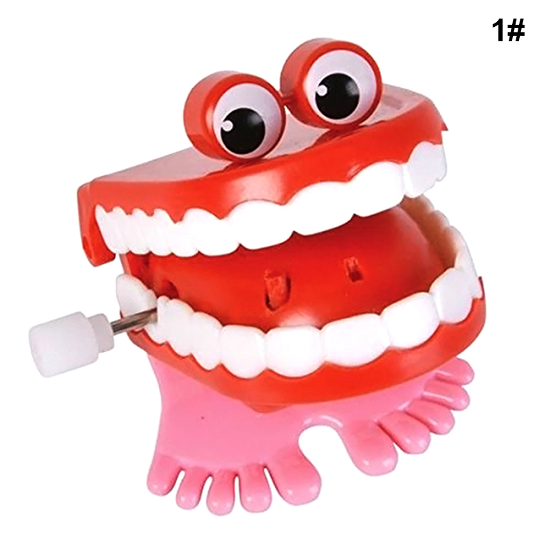 2 Colors JUMPING TEETH CHATTERING SMILE TEETH Small Feet Wind Funny Toys Up X3O7 