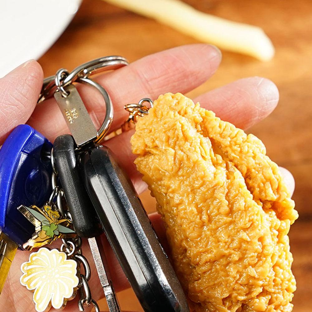 thumbnail image 2 of Wartleves Llavero de nuggets de pollo pulunto, llavero de comida, llavero de simulación de nuggets de pollo frito, llavero de ala para bolso de mano, 2 of 7