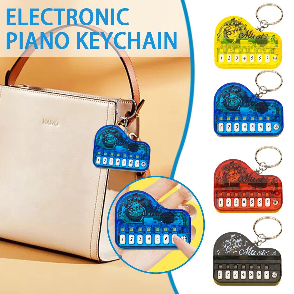 thumbnail image 2 of Ruifaya Llavero con instrumento musical portátil, juguete de piano, mini teclado electrónico, 2 of 7
